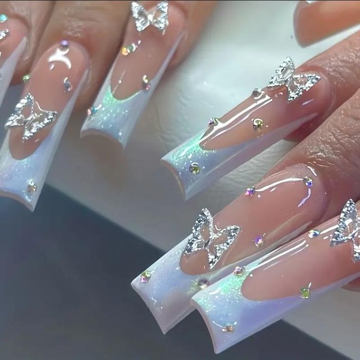 Elegant Ombre Acrylic Nails with Iridescent Glitter and Butterfly Accents.