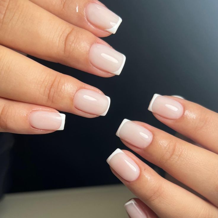 Elegant Classic French Tip Nails with Subtle Gradient Effect.