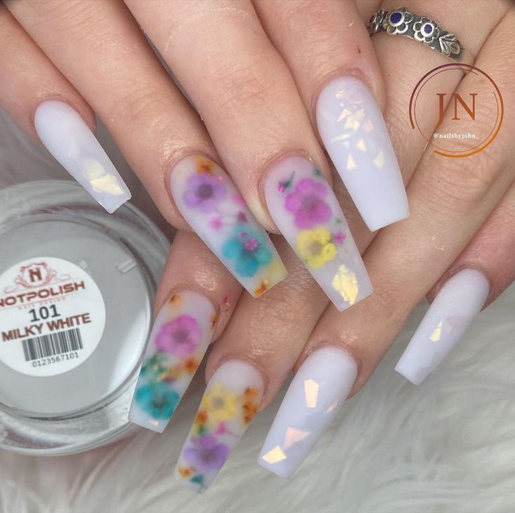 Pastel Floral Nail Design: Whimsical Elegance with Shimmering Accents.