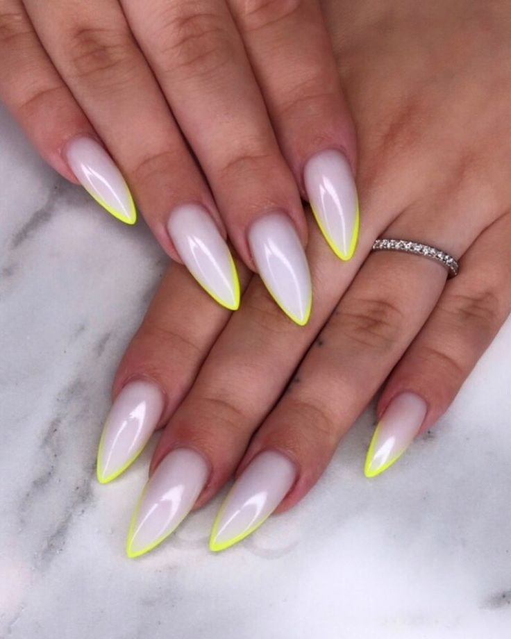 Elegant Stiletto Nails with Glossy Ombre and Neon Yellow Tips.