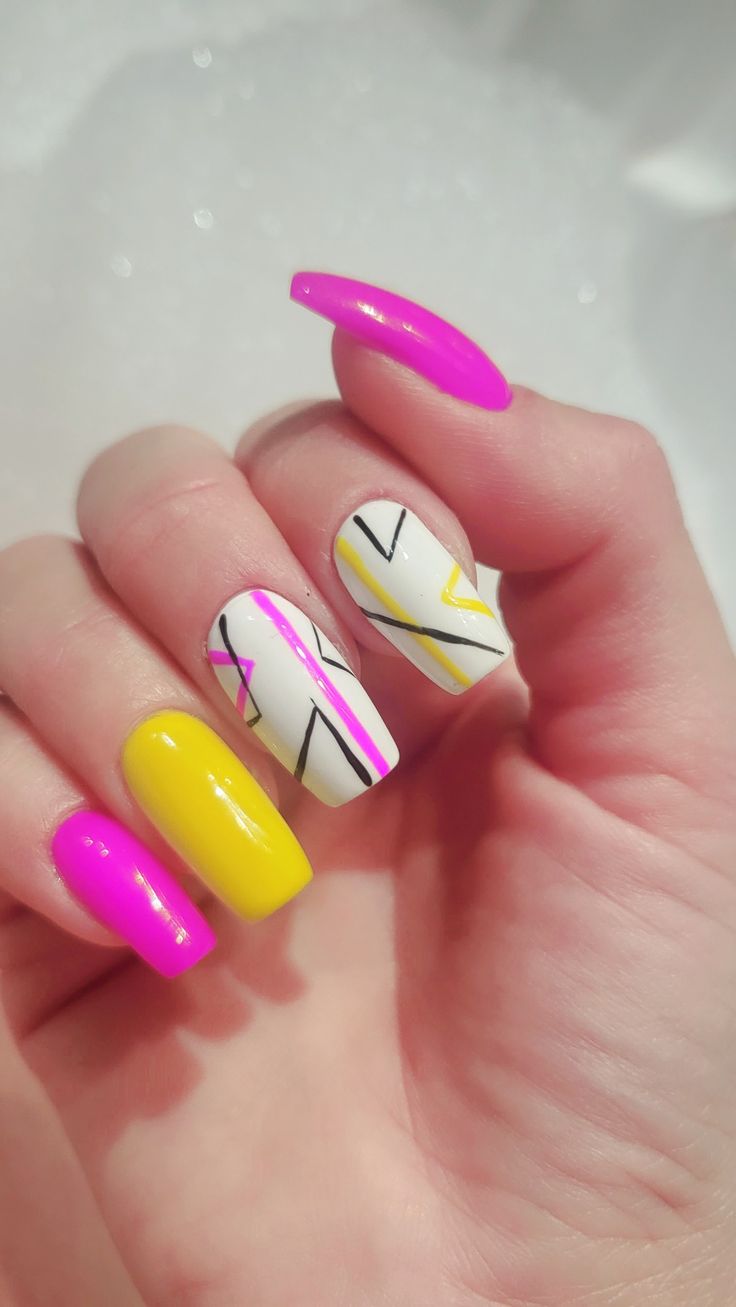 Bold and Chic Colorful Nail Design with Geometric Patterns.