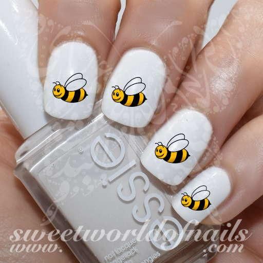 Whimsical Bee-Themed Nail Design on Classic White Base.