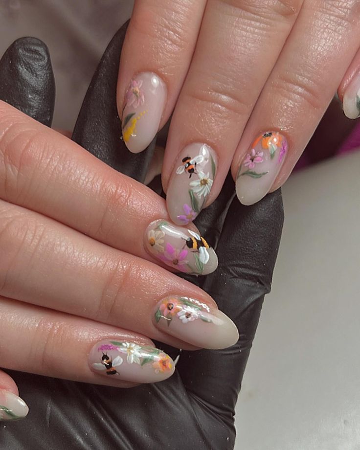 Elegant Pastel Floral Nail Design on Nude Base for Any Occasion.