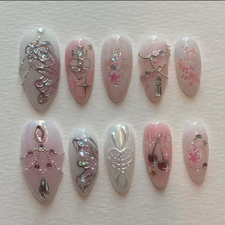 Chic Nail Art: Soft Pink Base with Intricate Patterns and Shimmering Accents