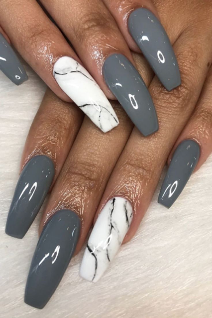 Elegant Matte Gray and Glossy White Nail Design with Chic Marble Accent.