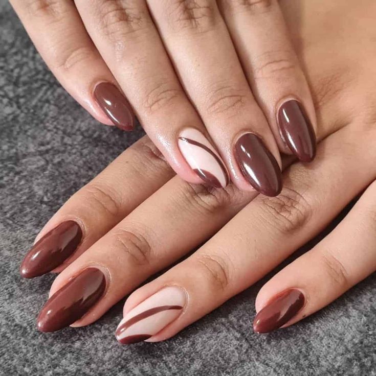 Elegant Almond-Shaped Nails: Rich Chocolate Brown with Soft Nude Accents and Sophisticated Swirls.