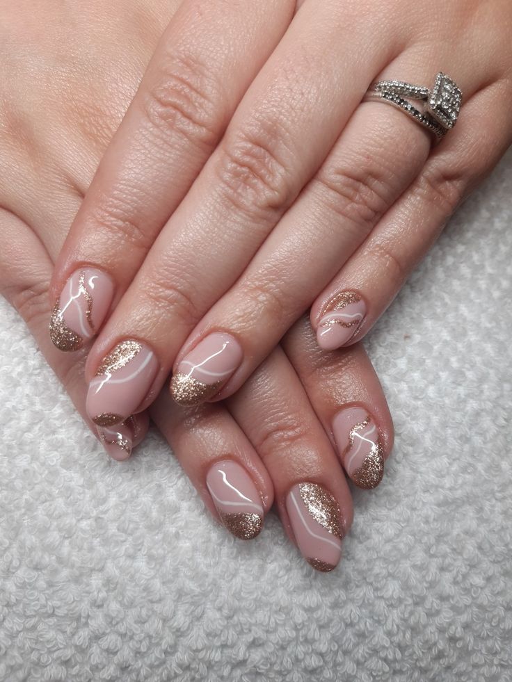 Chic Elegant Nail Design with Soft Pink, Gold Accents, and Glossy White Patterns.