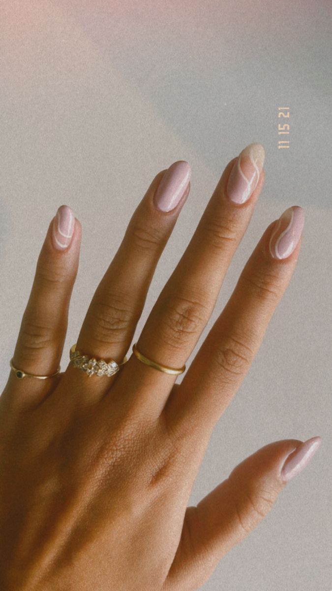 Sophisticated Soft Pink Nail Design with Delicate White Accents and Minimalistic Lines.