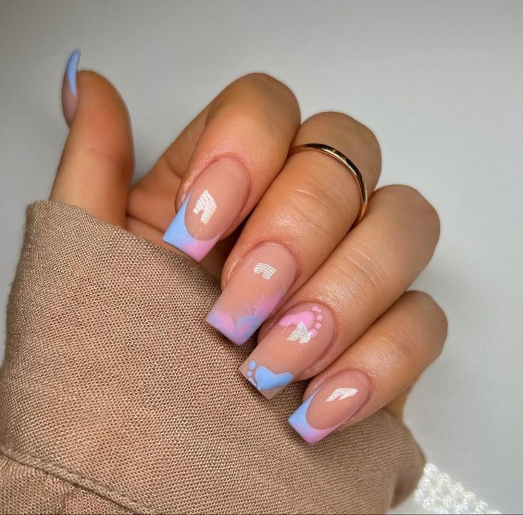 Chic Pastel Nail Design: Elegant Blue Tips with Playful Pink Accents and Heart Motifs.