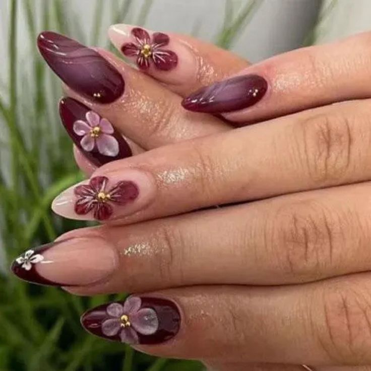 Elegant Deep Burgundy and Nude Manicure with Floral Accents for a Refined Look