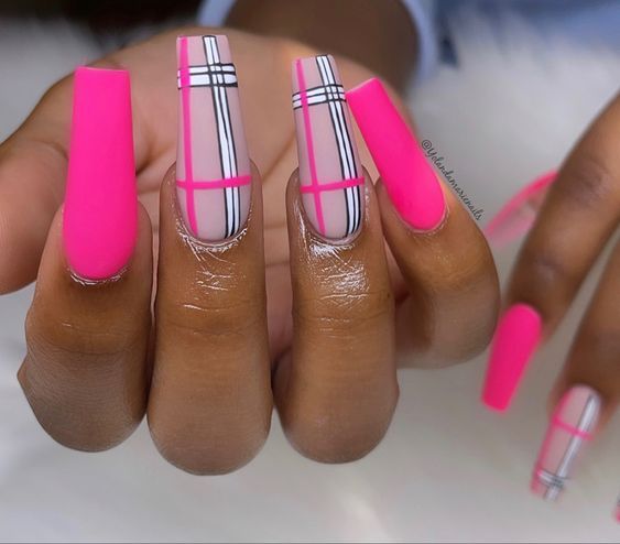 Striking Vibrant Pink Nail Art with Bold Geometric Designs and Sophisticated Patterns.