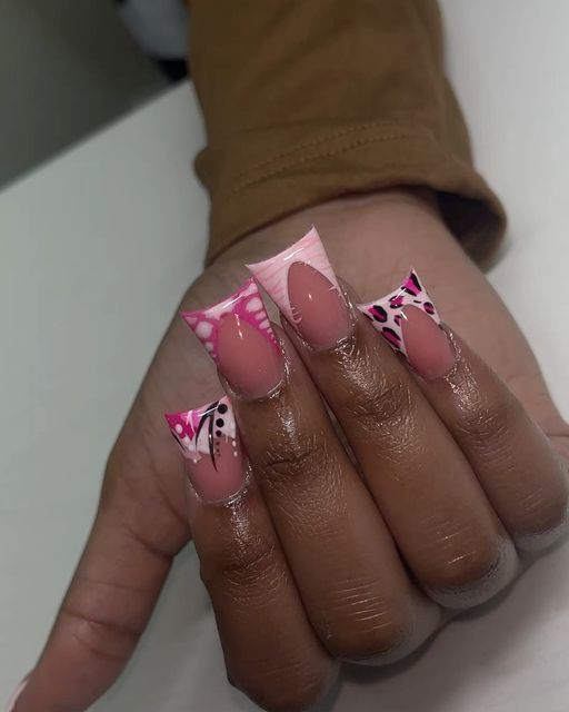 Chic Nail Design: Pastel Pink with Geometric Patterns and Floral Accents.