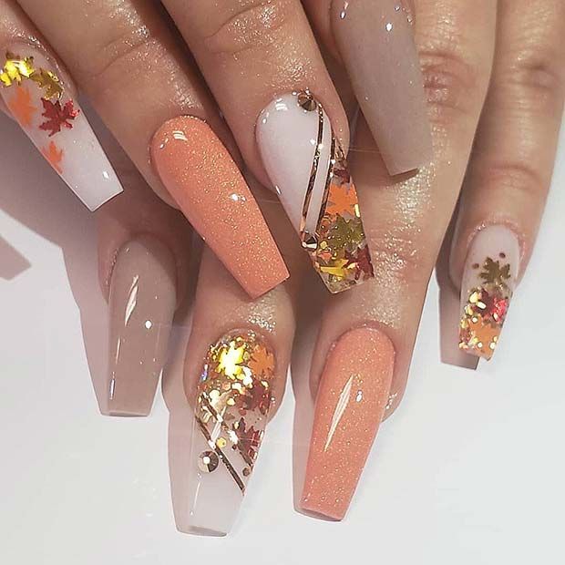 Elegant Autumn-Inspired Nail Design with Pastel Tones and Metallic Accents.