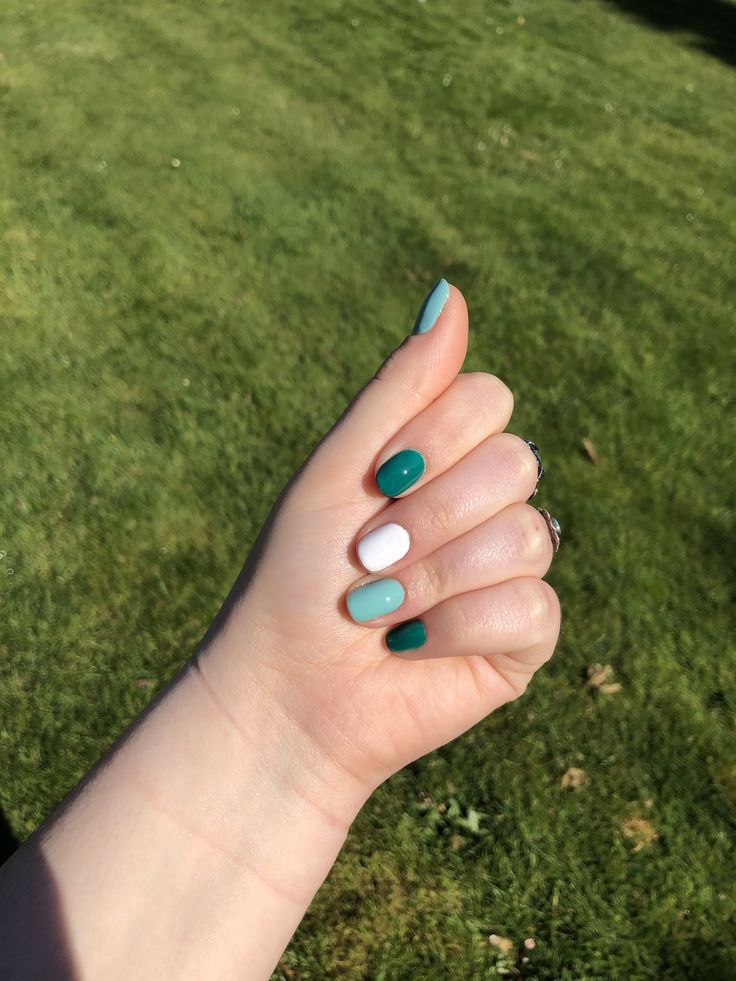 Vibrant Teal, White, and Aqua Nail Design: Trendy and Playful for Any Occasion.