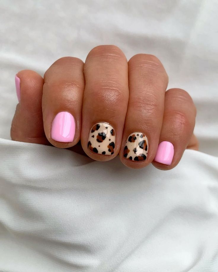 Trendy Playful Nail Design with Colorful Patterns and Accent Spotting