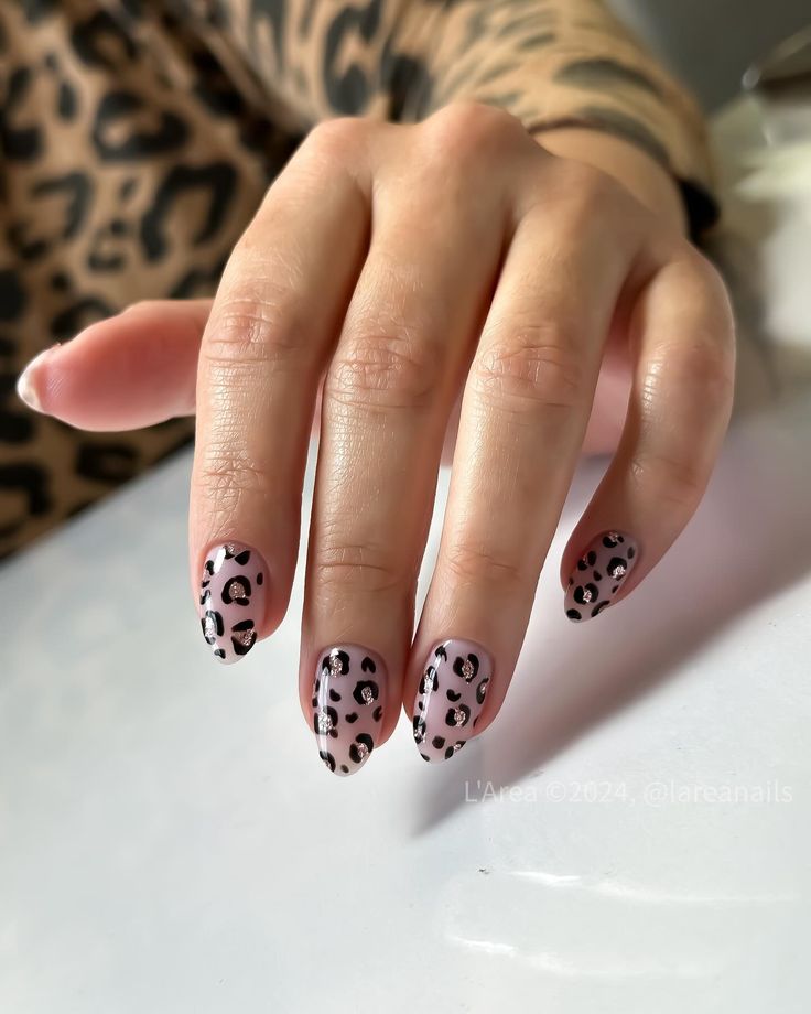 Chic Leopard Print Nail Design with Playful Pink Background.