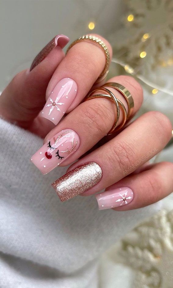 Charming Holiday Nail Design with Festive Reindeer and Glittery Accents