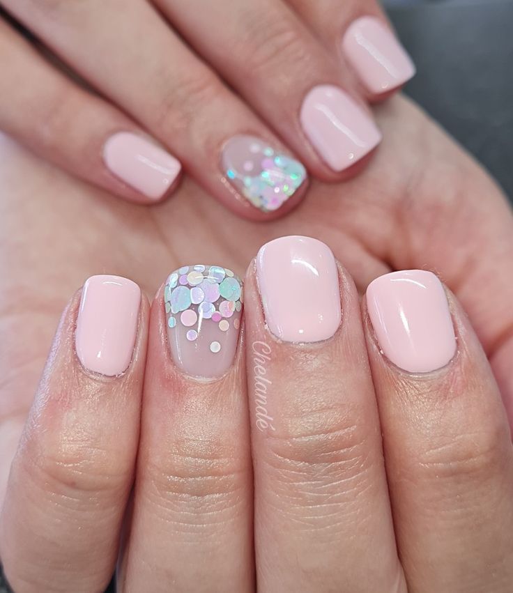 Charming Pastel Nail Design with Iridescent Confetti Accents for a Fresh Aesthetic.