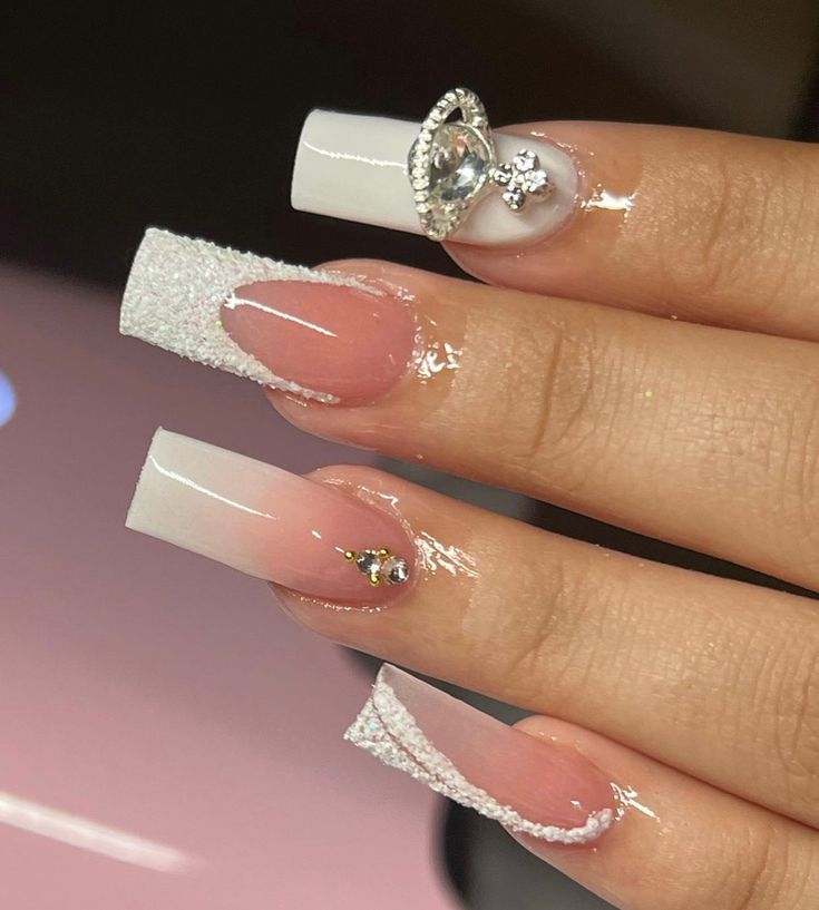 Sophisticated Long Acrylic Nails: Classic French Tips with Glamorous Embellishments and Textured Accents.