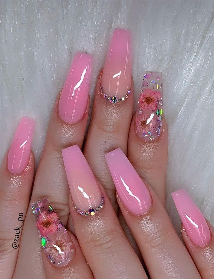 Elegant Pink Nails with Floral Accent and Rhinestone Detailing for Versatile Charm.