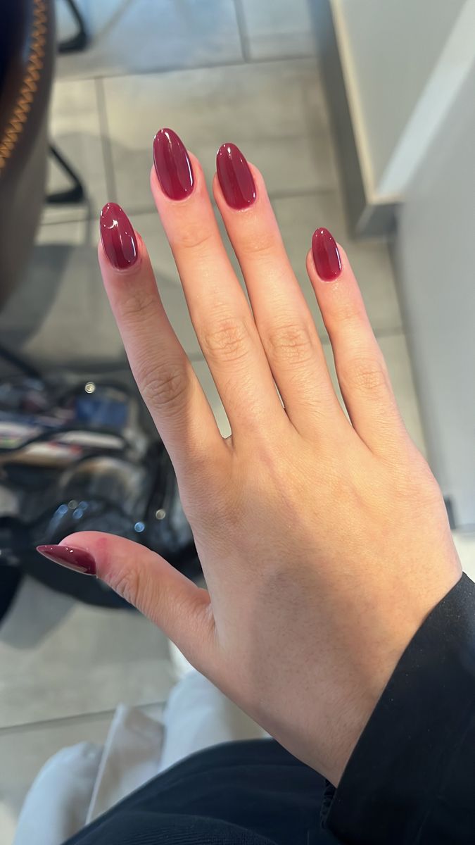 Sophisticated Deep Burgundy Almond-Shaped Nails for Any Occasion.