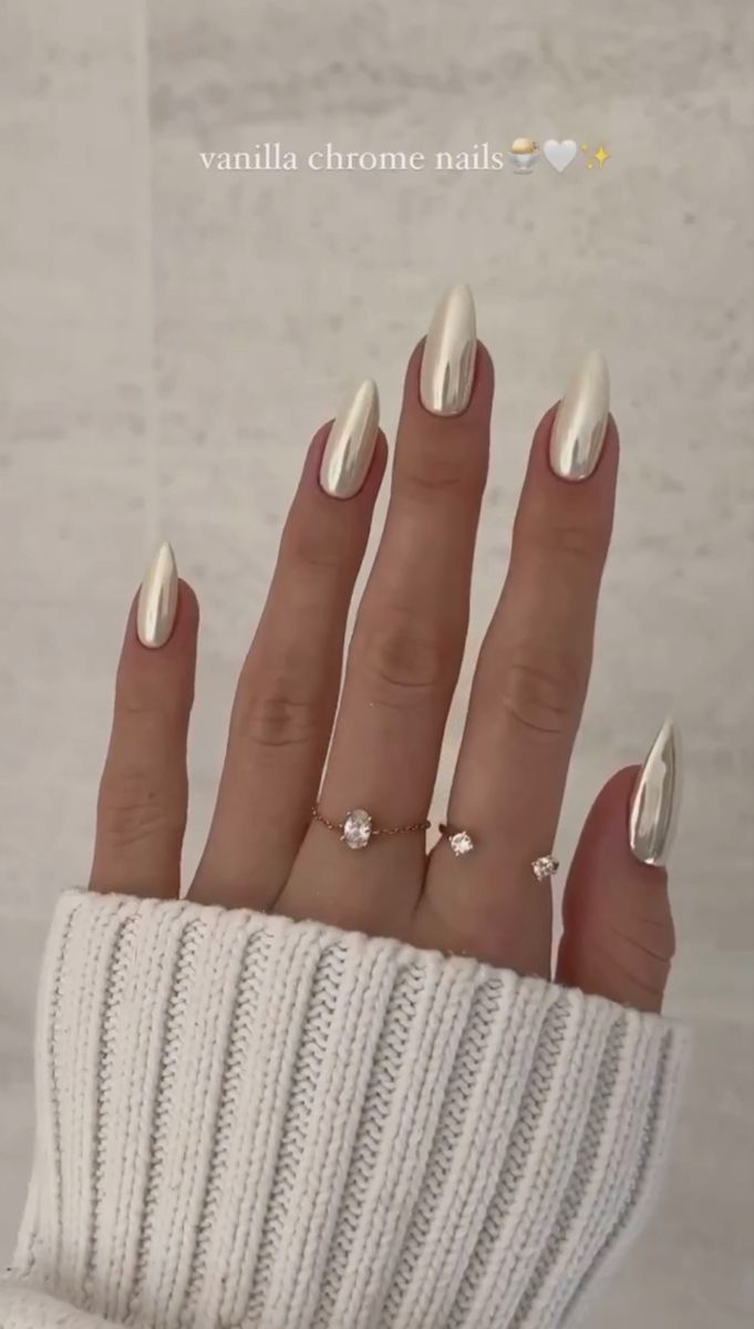 Sleek Vanilla Chrome Nails: A Chic Stiletto Design for Any Occasion.