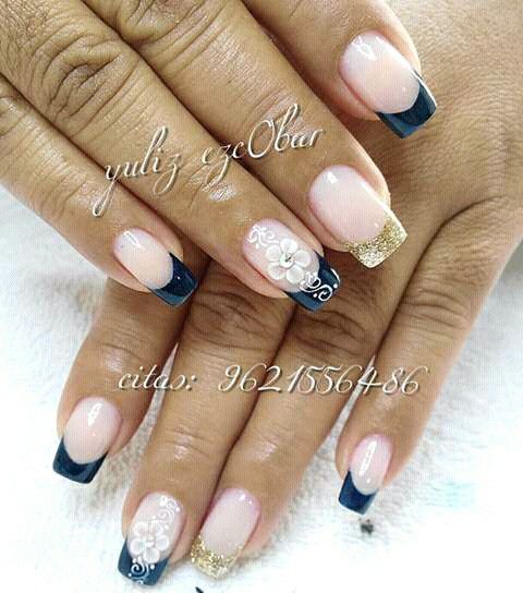 Chic Beige and Navy Nail Design with Floral Accents and Gold Highlights.