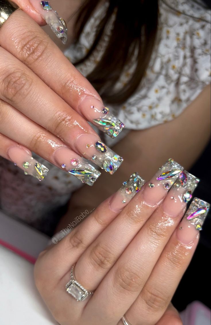 Glamorous Glittering Nail Design with Iridescent Elements for Bold Fashion Statements.