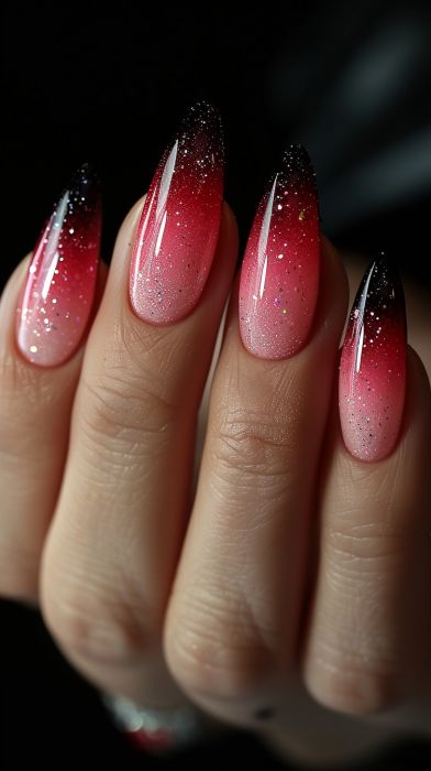 Bold Ombre Nails: Deep Pink and Vibrant Red with Glittering Black Tips.