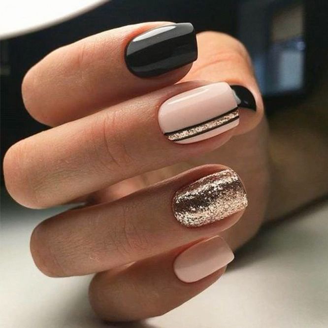 Modern Chic Nail Design with Glossy Black, Soft Nude, and Glamorous Gold Accents.