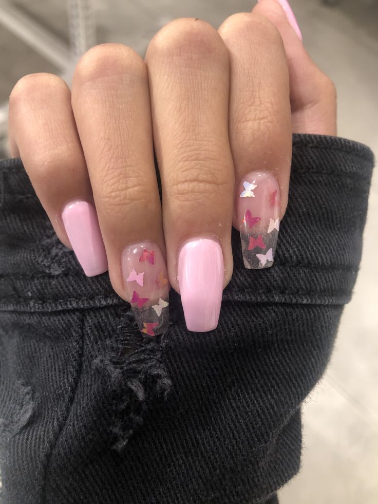 Chic Soft Pink Nail Design with Playful Butterfly Glitter Accents.