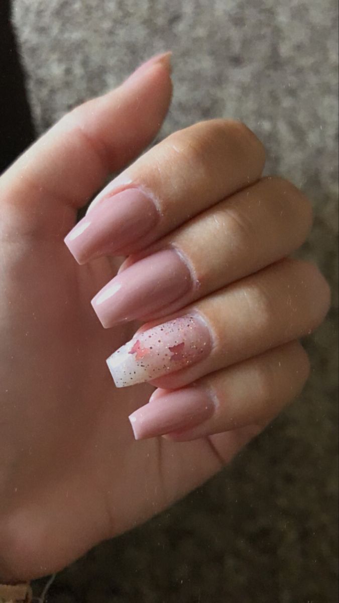 Chic Soft Pink Long Square Nail Design with Sparkling White Accent and Floral Glitter Details.