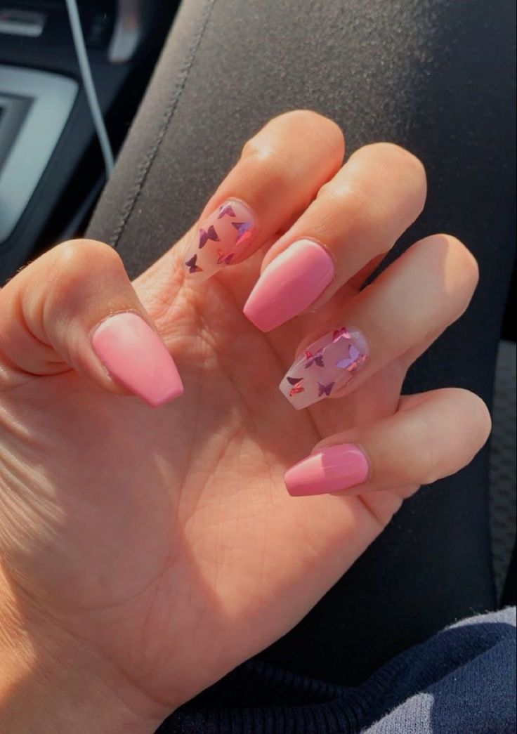 Elegant Nail Design with Soft Pink Shades and Colorful Butterfly Glitter Accents.