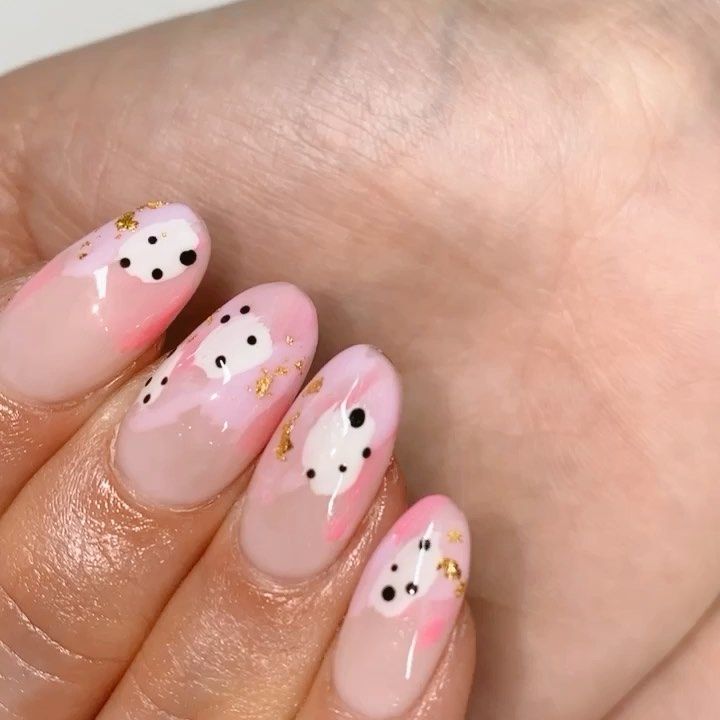 Whimsical Pink Ombre Nail Design with Playful Bear Faces and Elegant Gold Accents