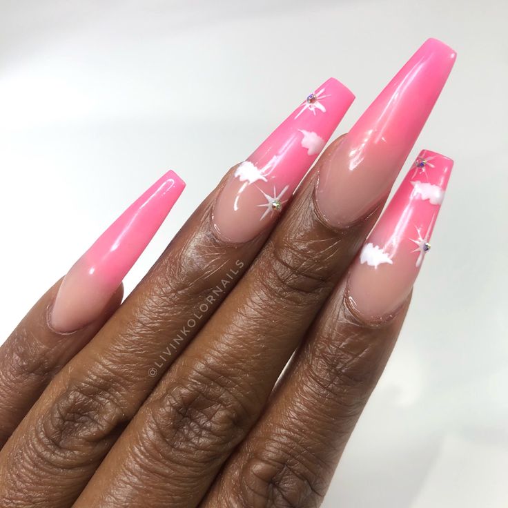 Fresh Pastel Pink Ombre Nails with White Cloud Designs and Sparkling Accents for a Playful Summer Vibe.