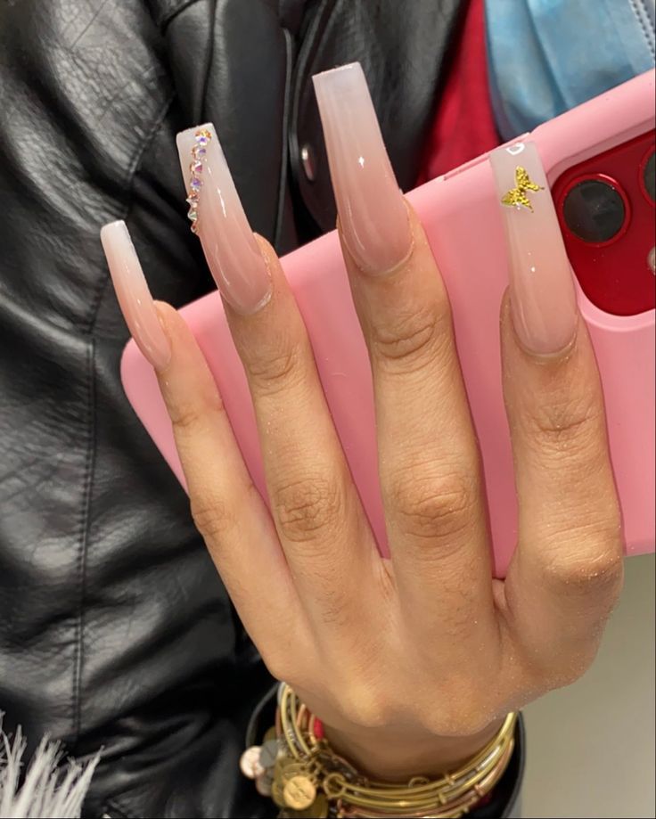 Elegant Ombre Acrylic Nails with Glamorous Accessories and Chic Pink Phone Case