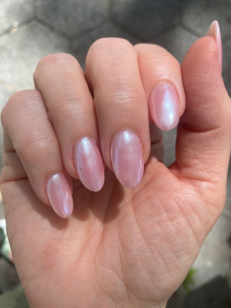 Elegant Pastel Almond Nails with Shimmering Pearlescent Finish and Subtle Iridescent Hues.