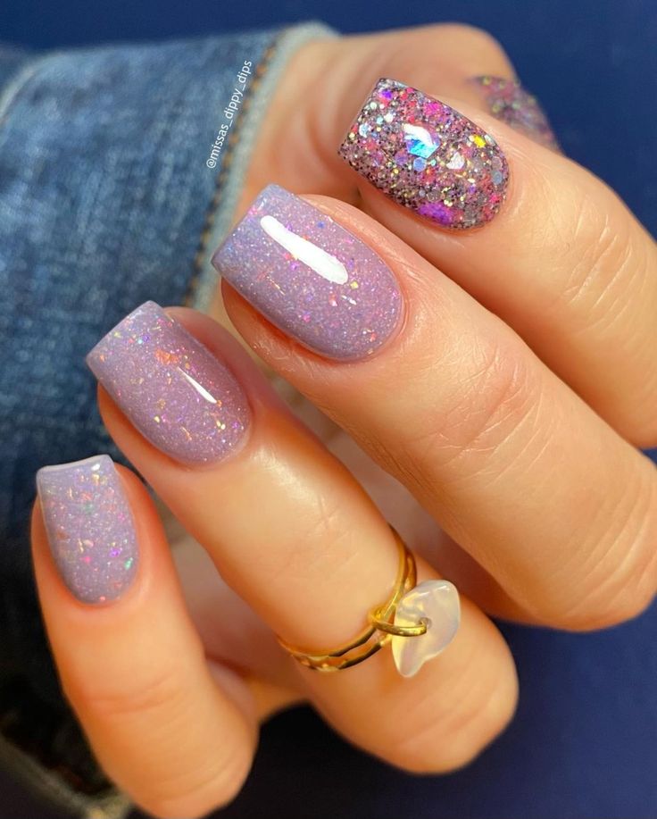 Elegant Lavender Nail Design with Shimmering Glitter Accents and Holographic Effects.