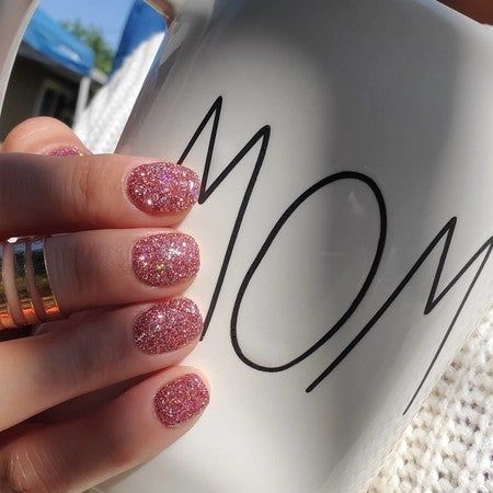 Vibrant Sparkling Pink Glitter Nails: A Playful and Eye-Catching Manicure for Any Occasion.