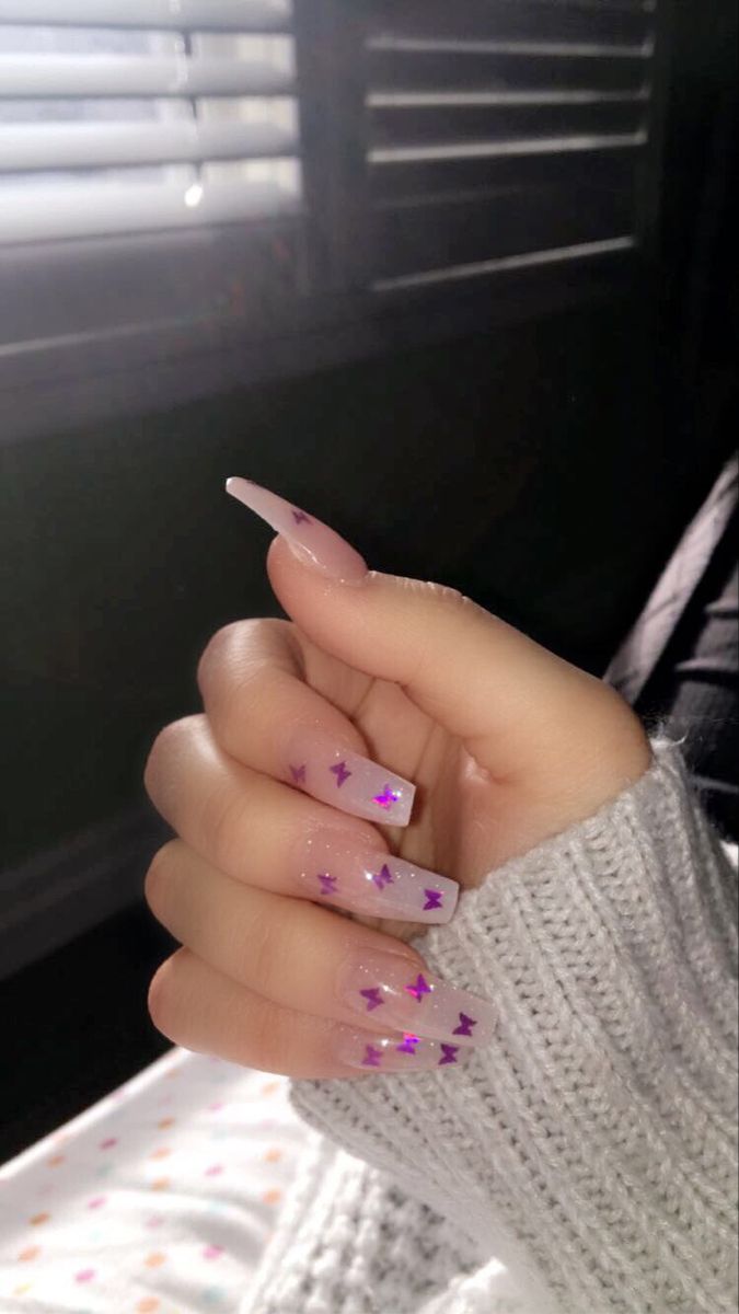 Chic Ombre Nail Design with Shimmering Purple Star Accents