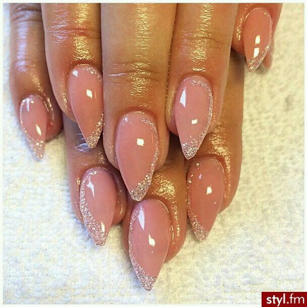 Elegant Pointed Nails with Soft Pink Base and Sparkly Silver Glitter Accent.