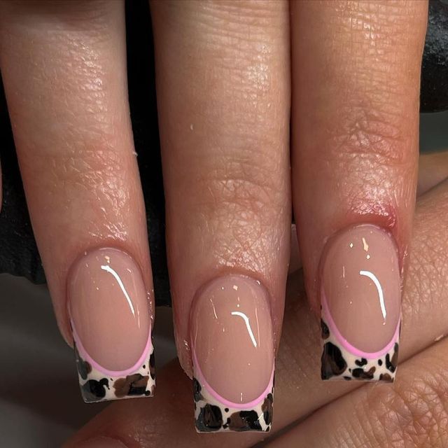 Chic Nude French Tip Nails with Playful Leopard Print and Pink Outline.