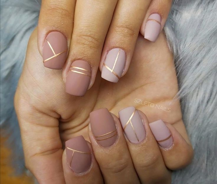 Chic Elegant Nail Design with Soft Nude Shades and Golden Stripes