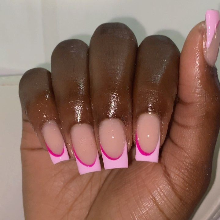 Chic Pink Nail Design with Bold Hot Pink Tips: A Playful Twist on Classic French Manicure.