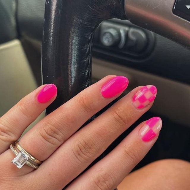 Bold and Playful Vibrant Pink Nail Design with Glossy Finish and Eye-Catching Pattern.