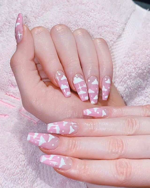 Whimsical Cloud-Patterned Soft Pink Nail Design for a Playful Aesthetic