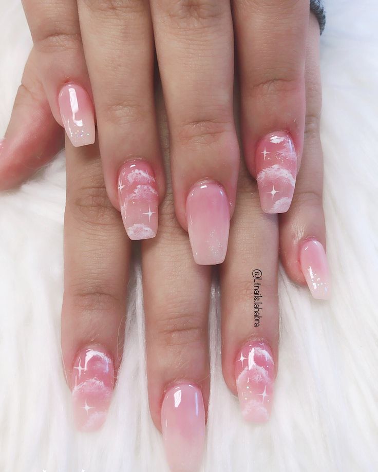 Dreamy Pastel Ombre Nails with Whimsical Cloud Designs and Sparkling Accents.