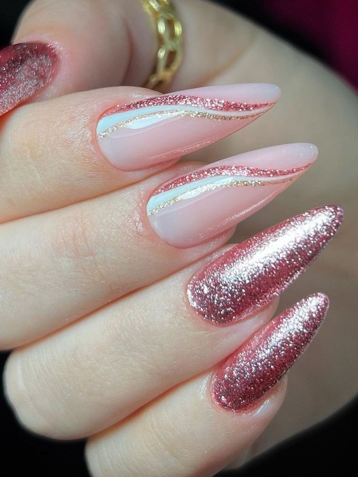 Chic Almond-Shaped Nails in Soft Pink and Shimmering Rose Gold with Gold Striping.