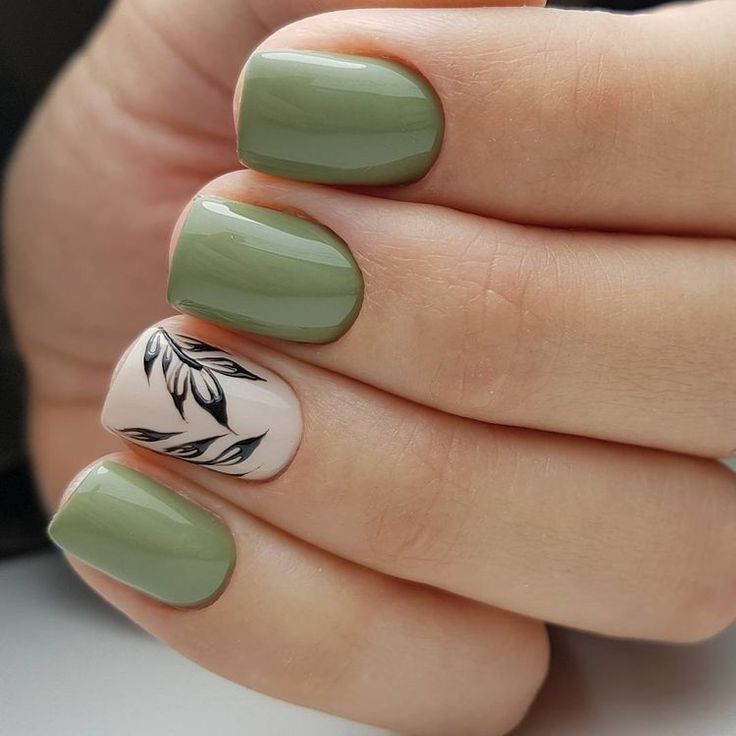 Sleek Green Nail Design with Floral Accent: A Blend of Simplicity and Sophistication.