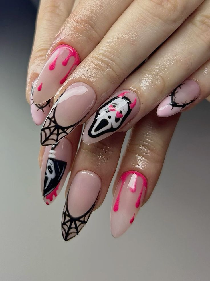 Spooky Halloween Nail Design with Intricate Artwork and Vibrant Accents